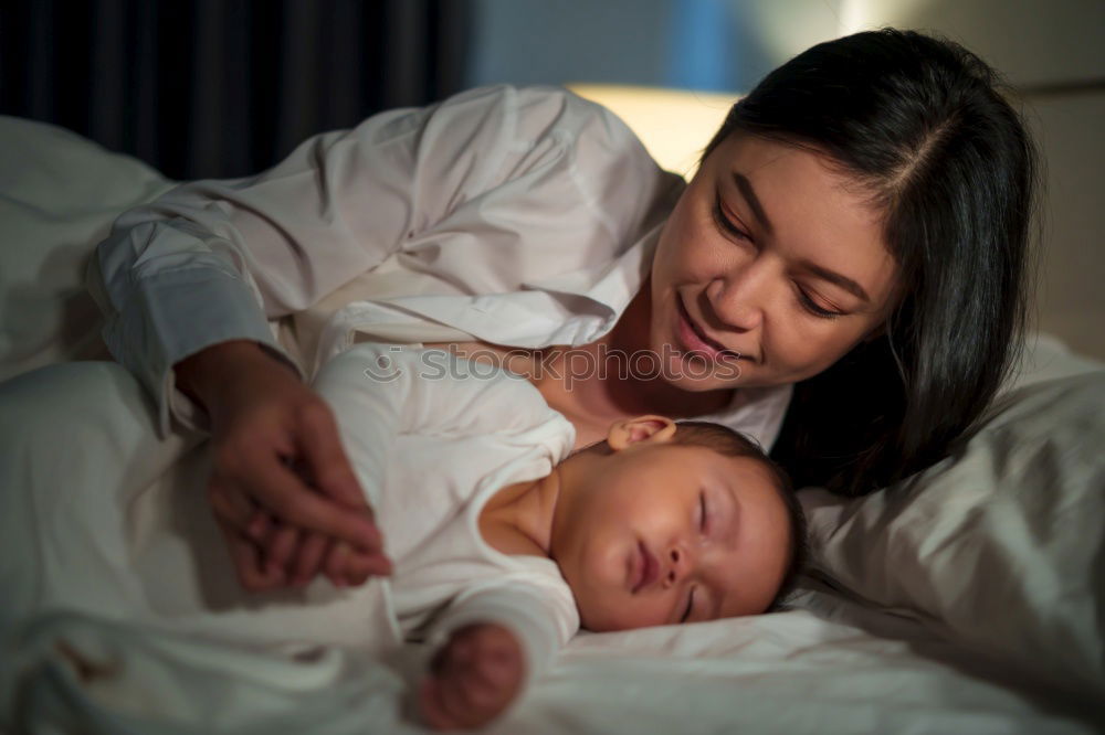 Similar – Image, Stock Photo Baby girl two months old smiling to her mother at home