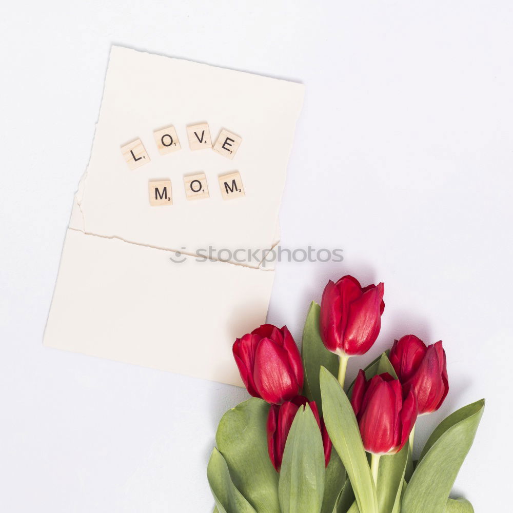 Similar – Table with cup of coffee, gift and pink tulips