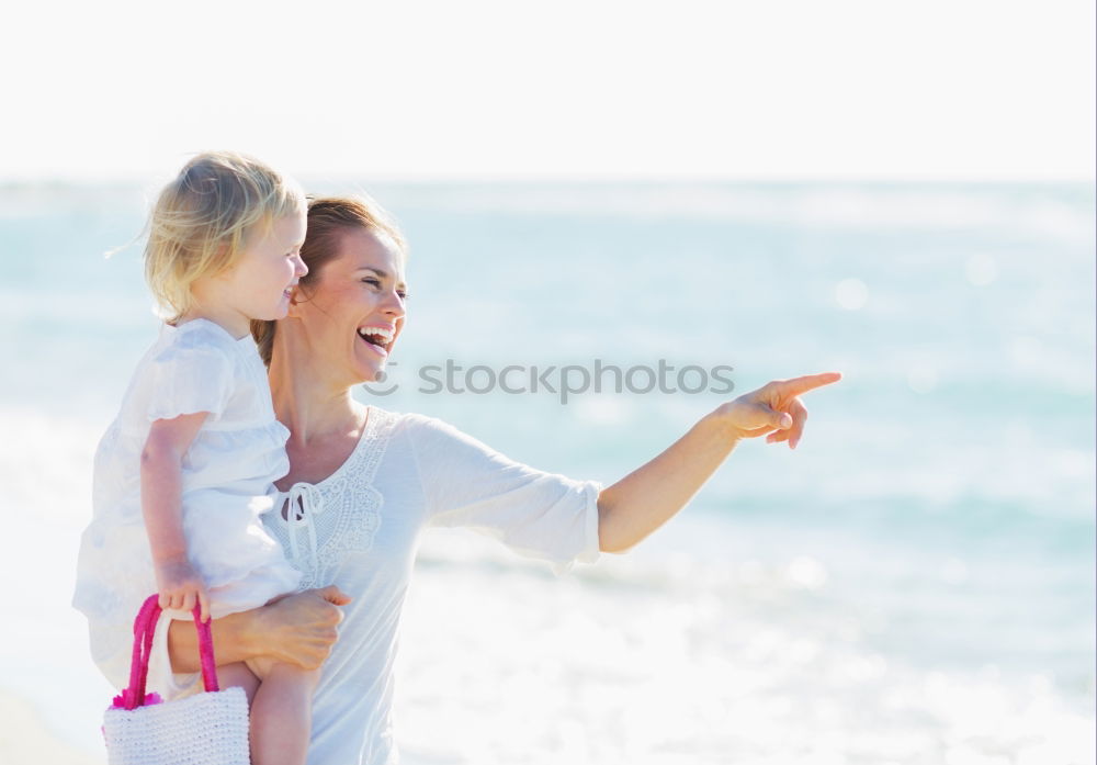 Similar – Father and children playing on the beach at the day time. Concept of friendly family.