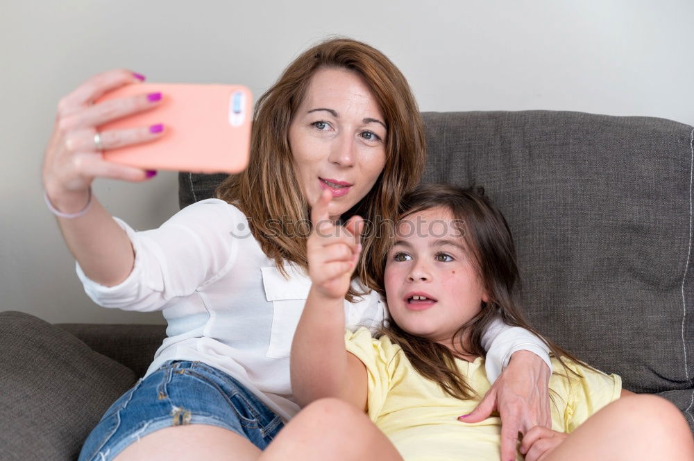 Similar – happy mother and daughter making selfie outdoor