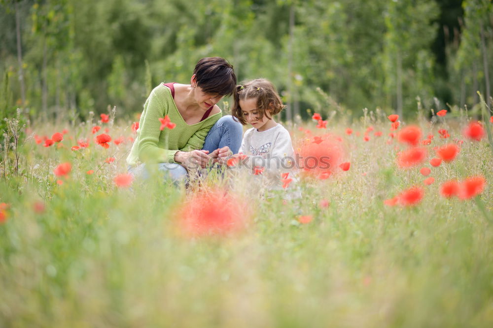 Similar – Image, Stock Photo Happy mother with her little daughter in poppy field