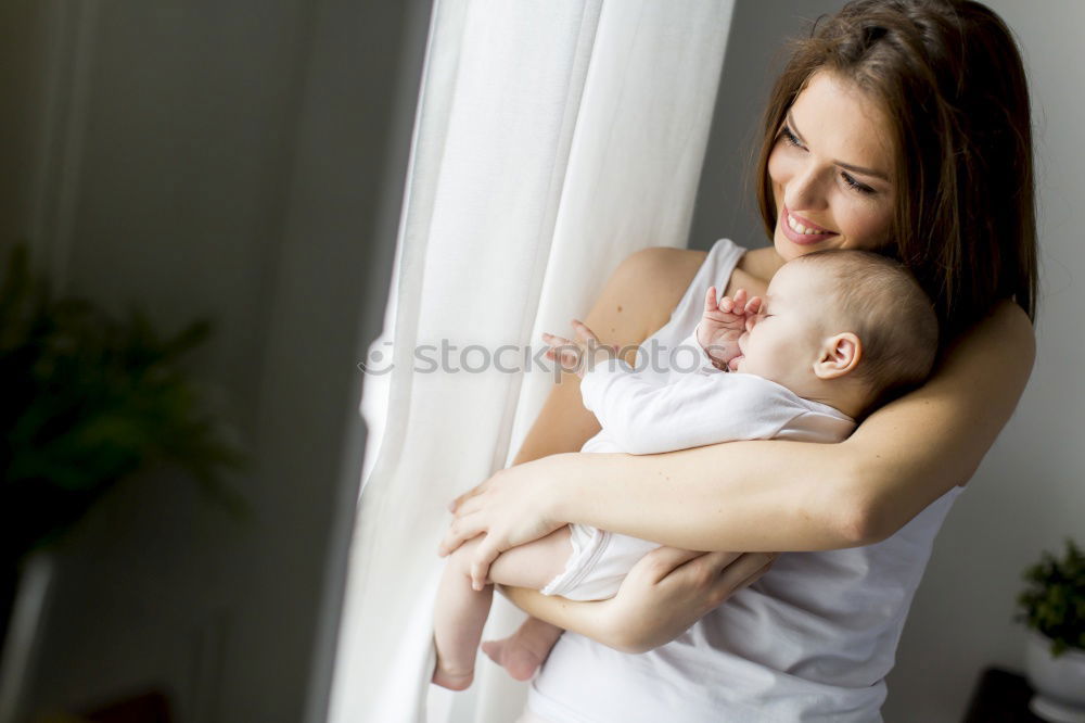 Similar – Image, Stock Photo Close-up of mother breastfeeding her little baby on the patio