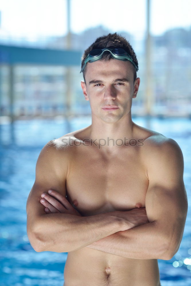 Similar – handsome swimmer putting on goggles