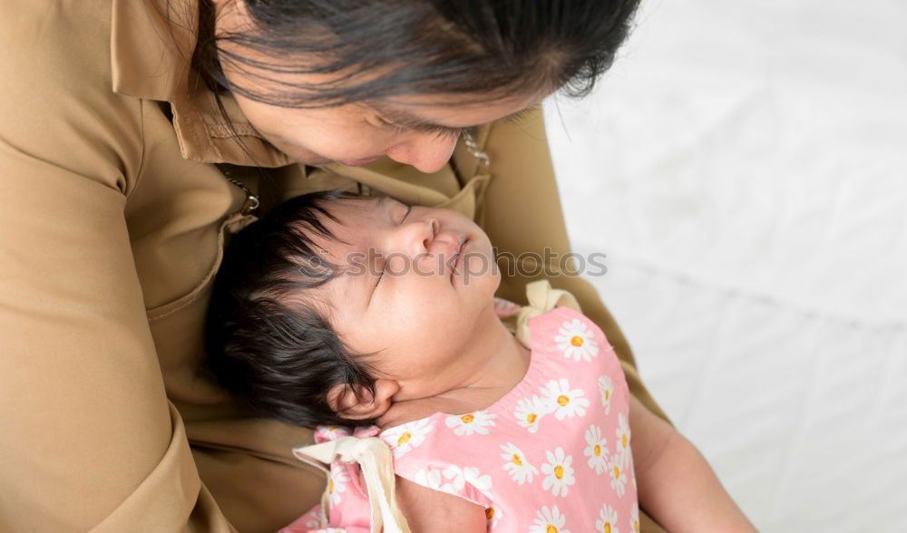 Similar – Image, Stock Photo Muslim mother holding a little baby by arms in outdoor area