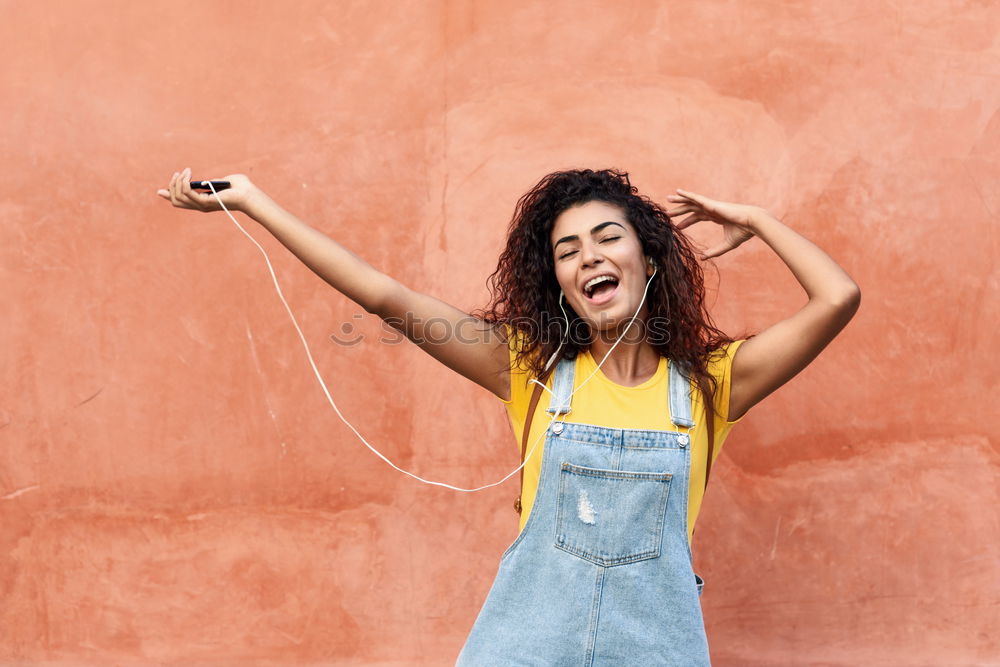 Similar – beautiful mixed girl listening to the music happy in the street