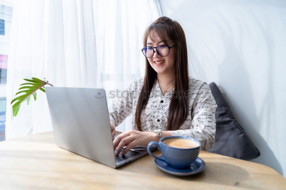 Similar – Image, Stock Photo Young beautiful woman with laptop , smartphone and coffee in a Restaurant