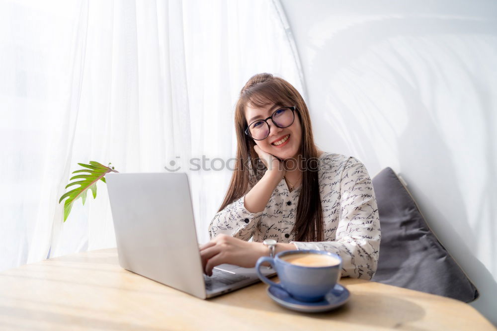Similar – Image, Stock Photo brunette woman is using her computer while having a coffee