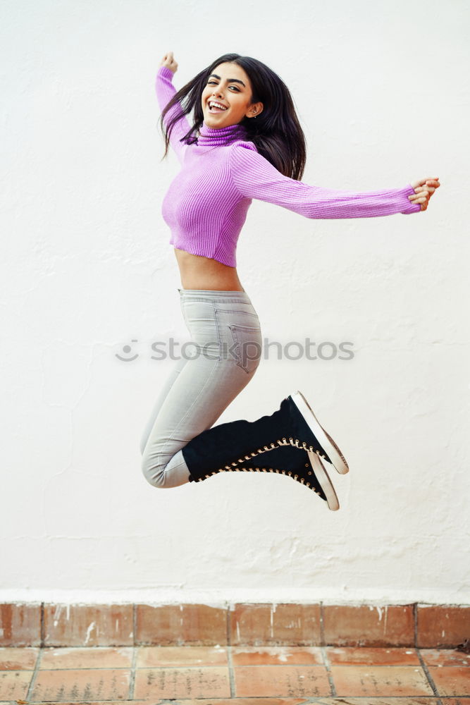 Similar – Image, Stock Photo Happy Arab woman, black curly hairstyle sitting on urban floor.