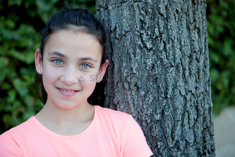 Happy preteen girl with blue eyes smiling