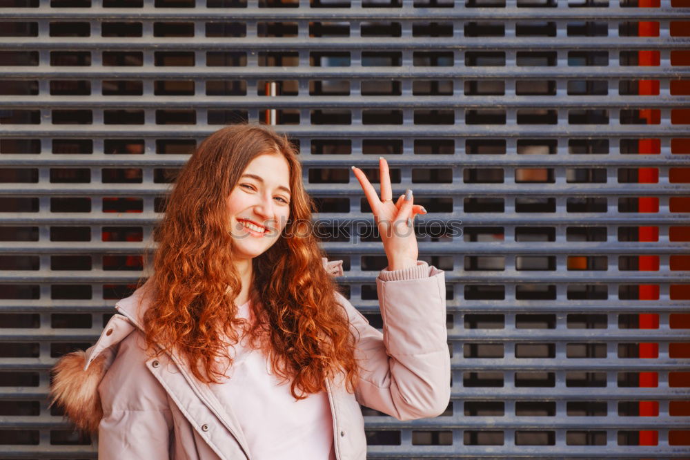 Image, Stock Photo Teenager girl in jeans with yellow backpack and bike standing on metro station, waiting for train, smiling, laughing. Orange train passing by behind the girl. Futuristic subway station. Finland, Espoo