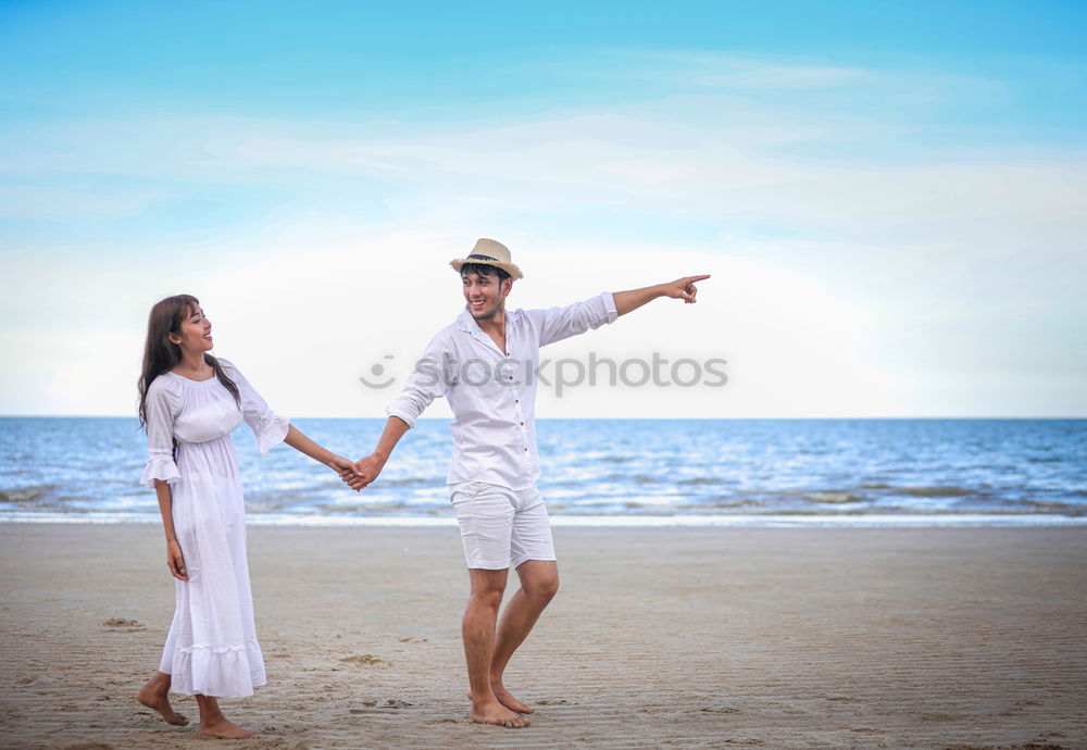 Similar – Happy family walking on the beach at the day time.