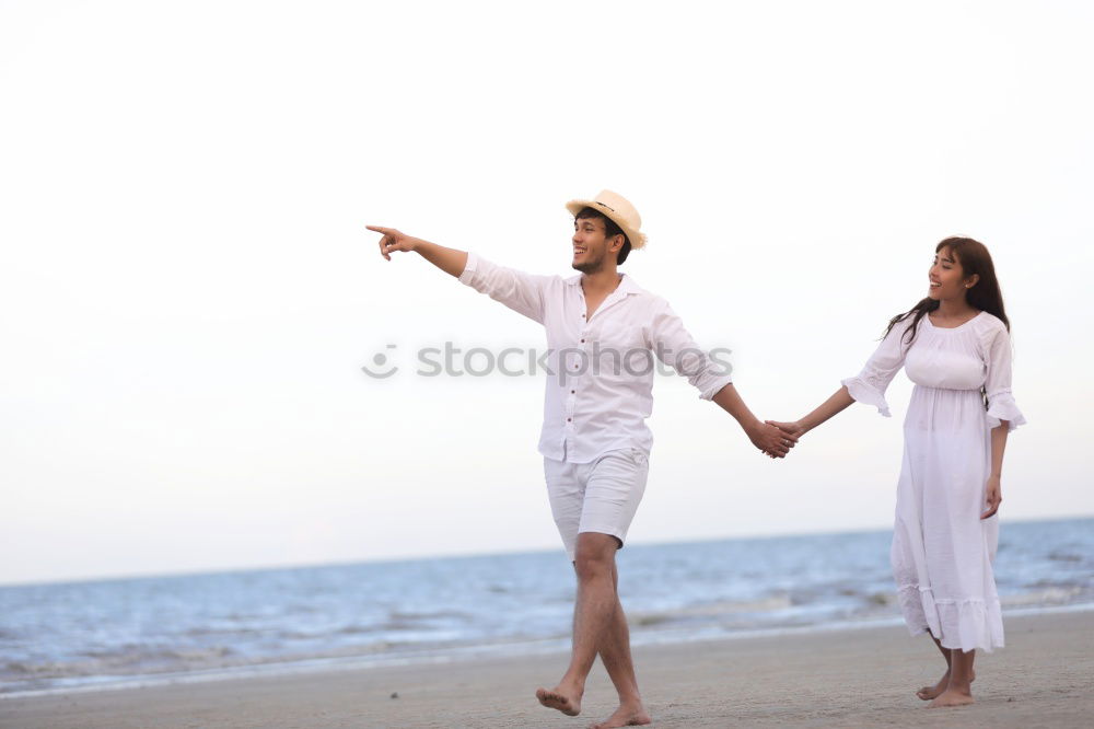 Similar – Happy family walking on the beach at the day time.