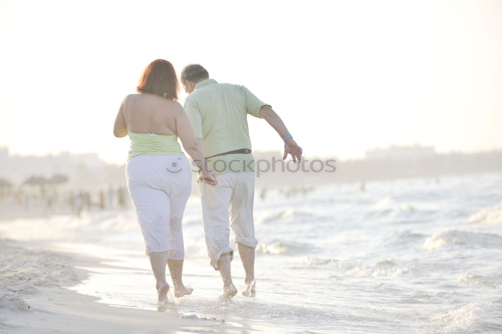 Similar – Image, Stock Photo Romantic bride and groom strolling on beach