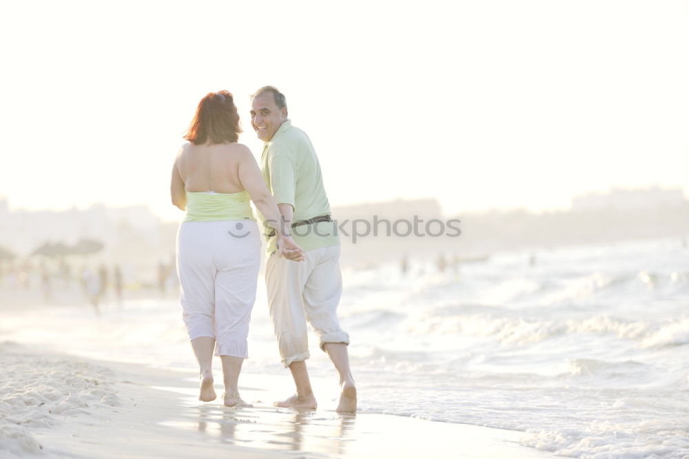 Similar – Image, Stock Photo Romantic bride and groom strolling on beach