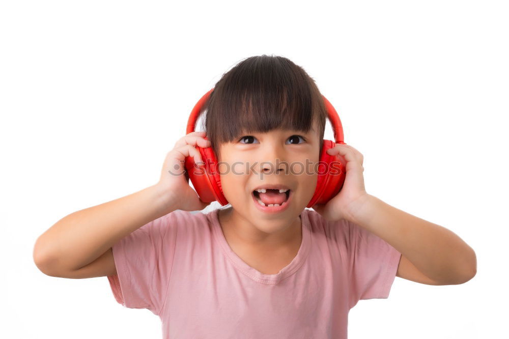 Similar – Child with headphones, listening to music