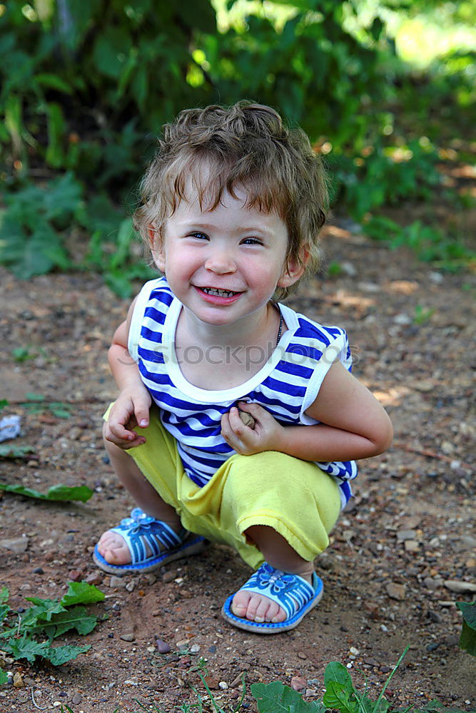 Cute child in the woods playing alone