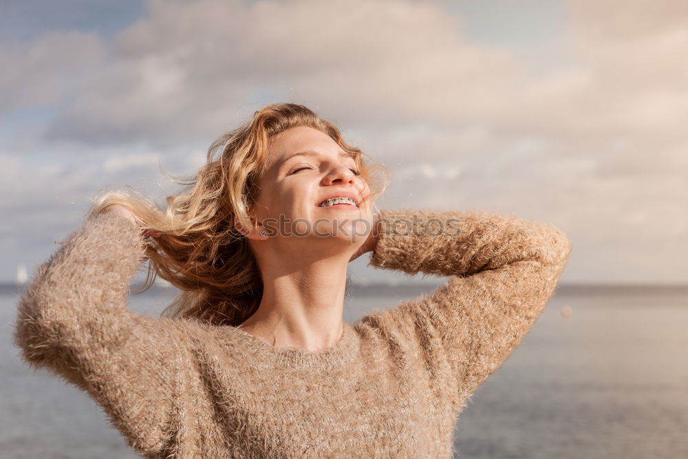 Similar – Happy senior woman sitting on the grass