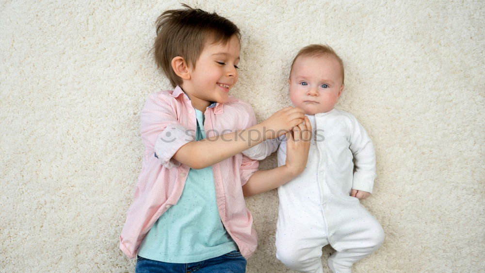 Similar – Brothers sitting at waterfront