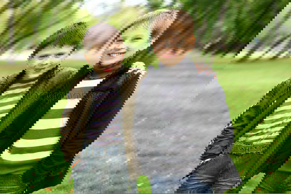 Similar – Image, Stock Photo Smiling twins brothers playing