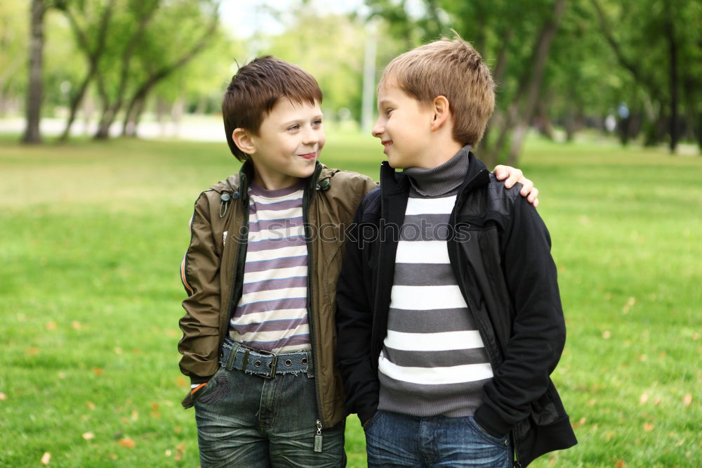 Similar – Brothers sitting at waterfront