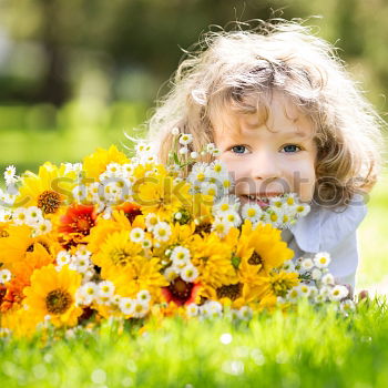 Similar – boy playing in sunflower field