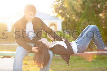 Similar – Happy girlfriend jumping on boyfriend’s back in the street