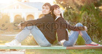 Similar – Happy friends sitting on steps