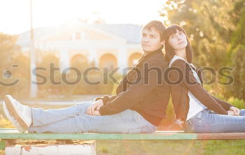 Similar – Two happy friends or sisters sitting and smiling