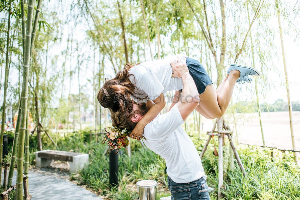 Similar – Couple lying at lake together