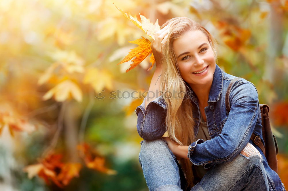 Similar – Image, Stock Photo Smiling young woman chatting on a mobile in autumn