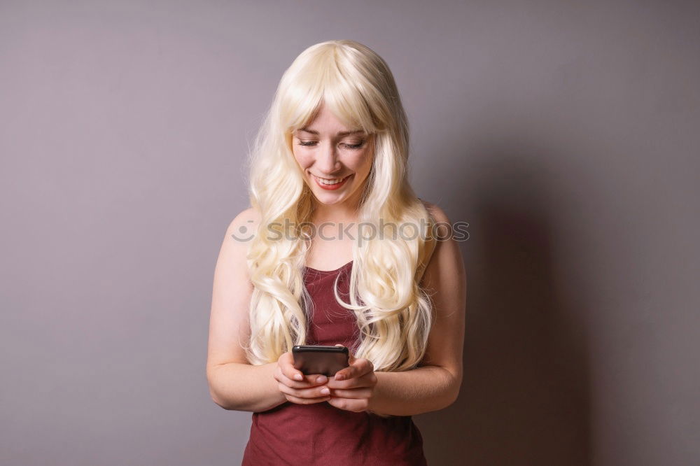 Similar – Image, Stock Photo Woman with grey dyed hair using her phone