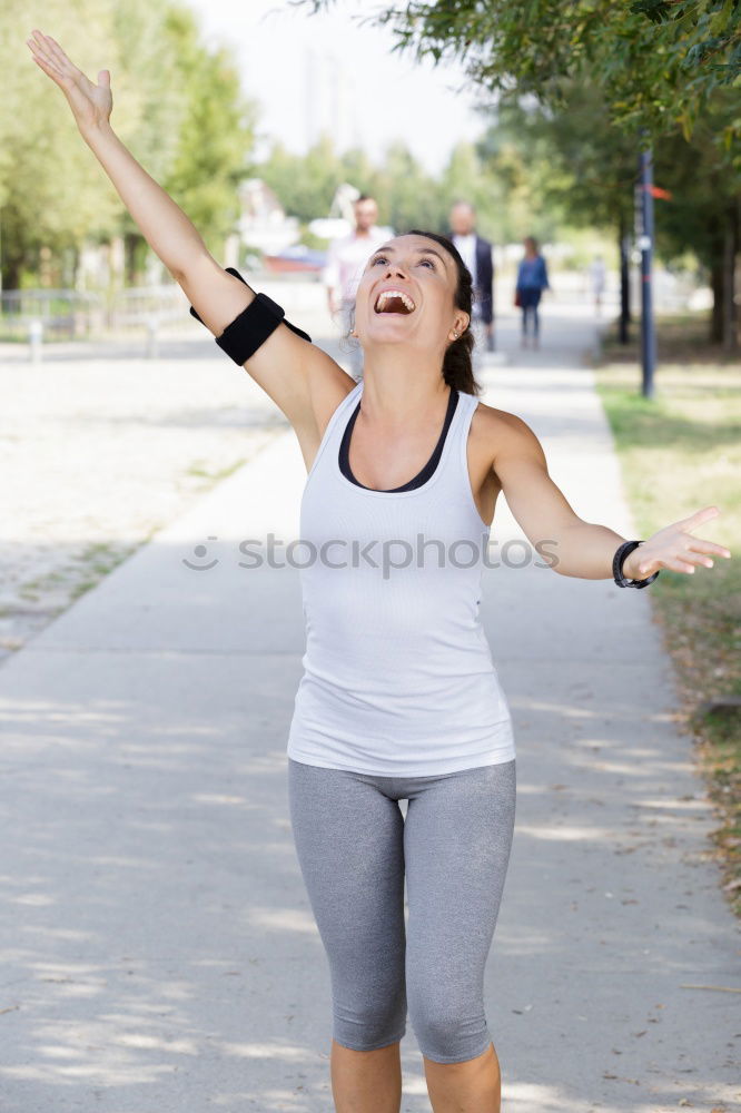 Similar – Senior runner man jumping arms up after running