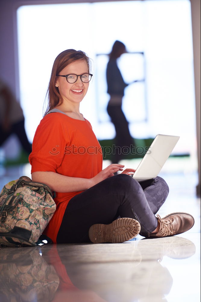 Similar – Image, Stock Photo Blonde girl using a smartphone while sitting on leather sofa