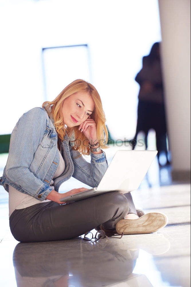 Similar – Image, Stock Photo Blonde girl using a smartphone while sitting on leather sofa