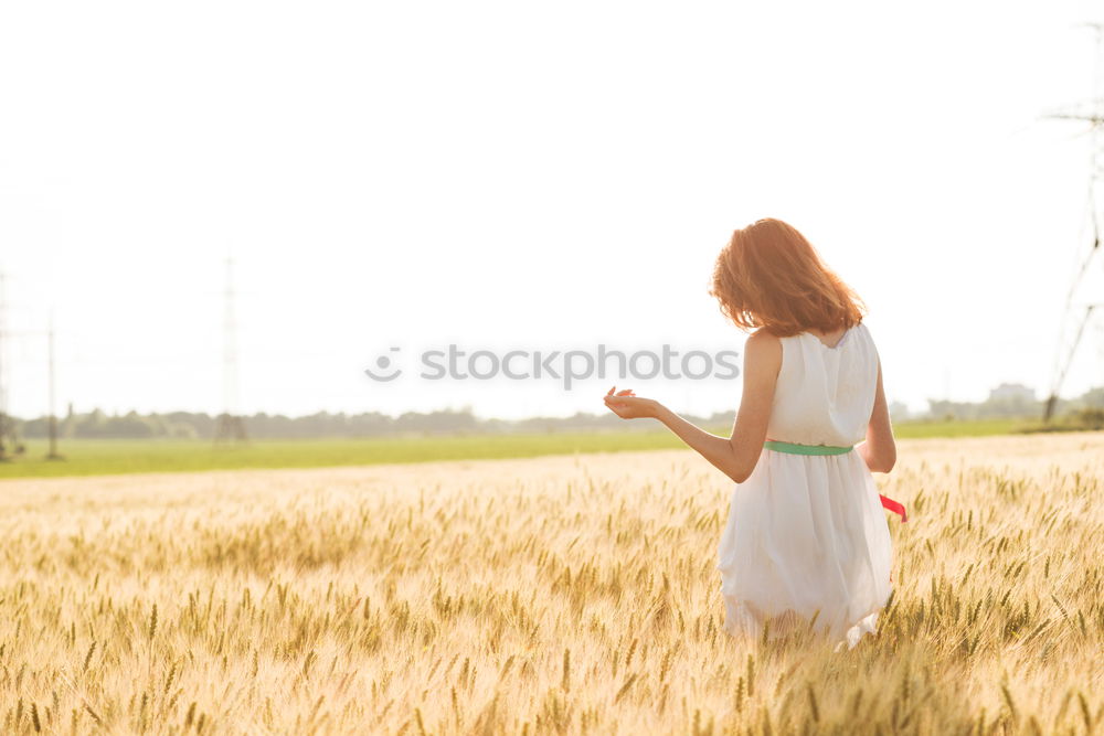 Similar – Woman walking on field