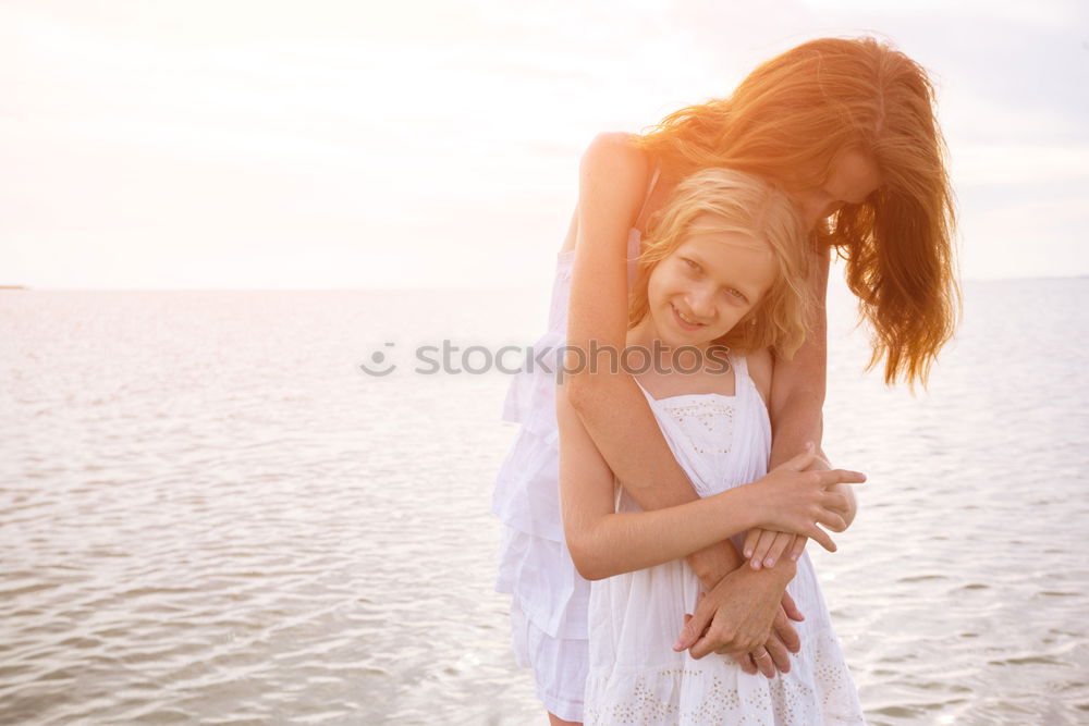 Image, Stock Photo Young adult mom giving toddler kiss on cheek