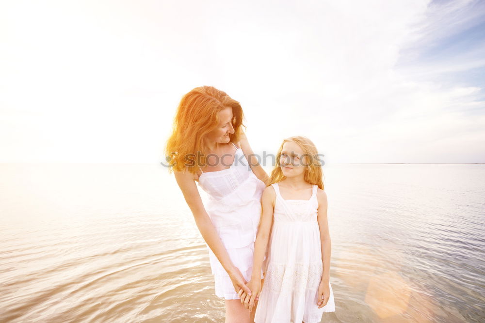 Similar – Image, Stock Photo Mother and son playing on the beach at the day time.