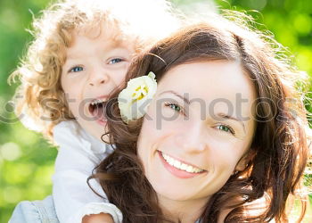 Similar – Happy mother and daughter playing in the park at the day time. Concept of celebration Mothers day .