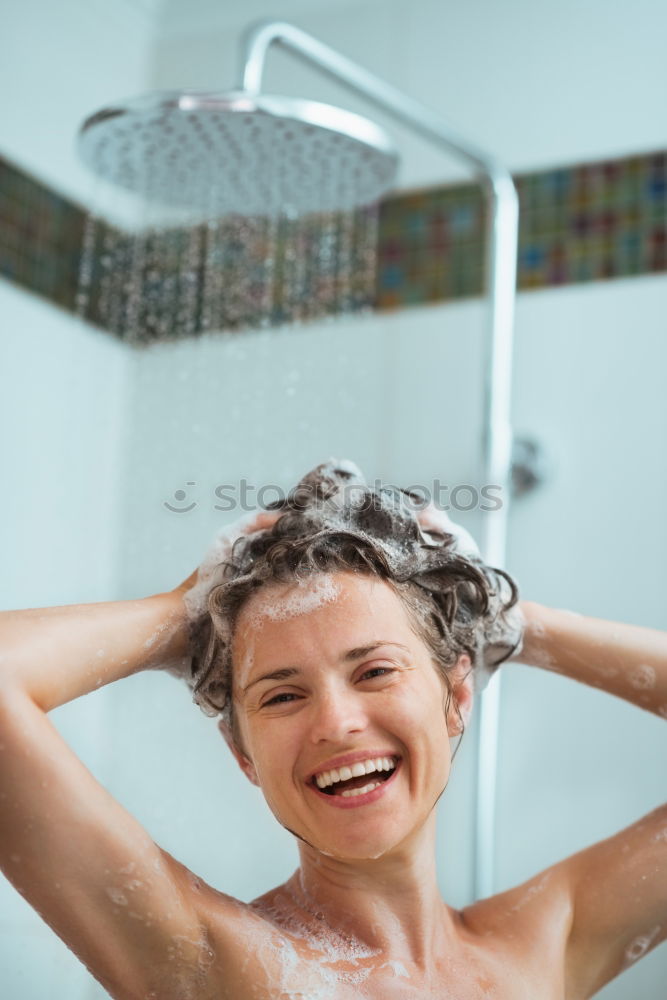 Similar – Young woman reacting in shock under shower