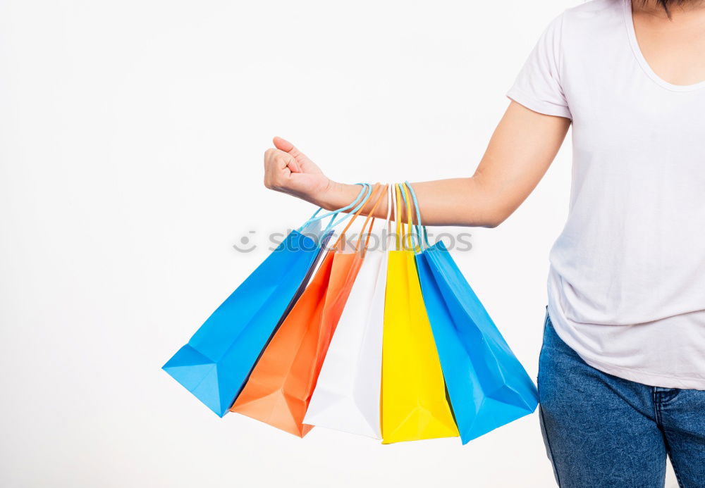 Similar – Shopping bags on womans hand. Woman shopping with colored paper bags.