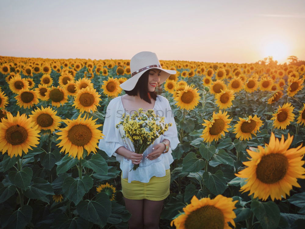 Similar – Image, Stock Photo Happy young black woman walking in a sunflower field