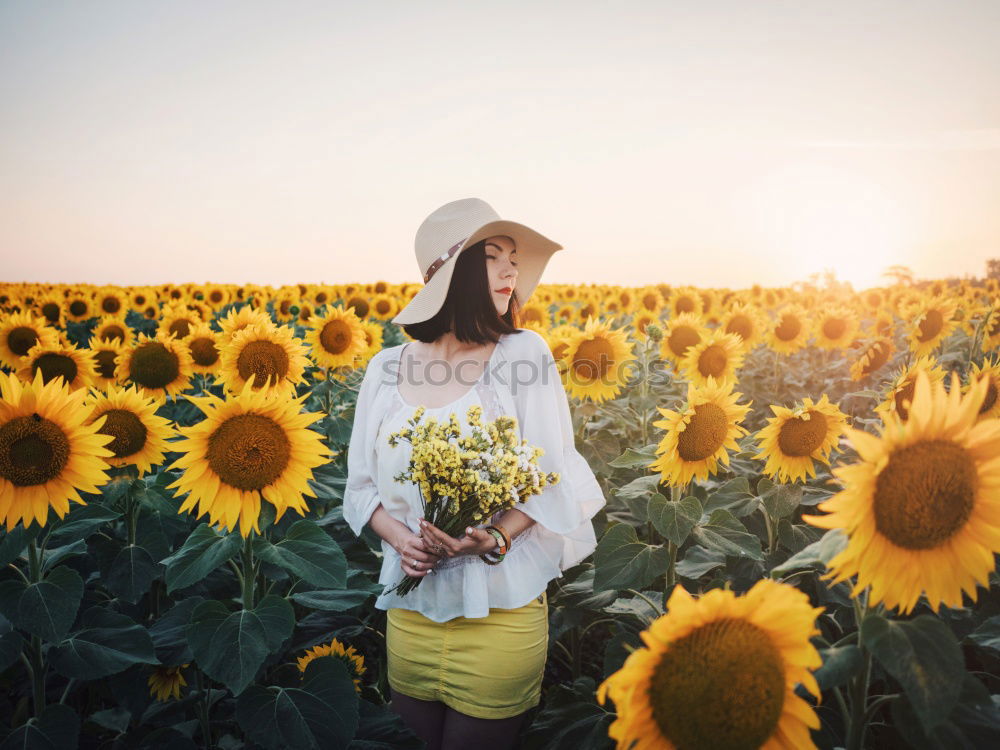 Woman in middle of wheat field