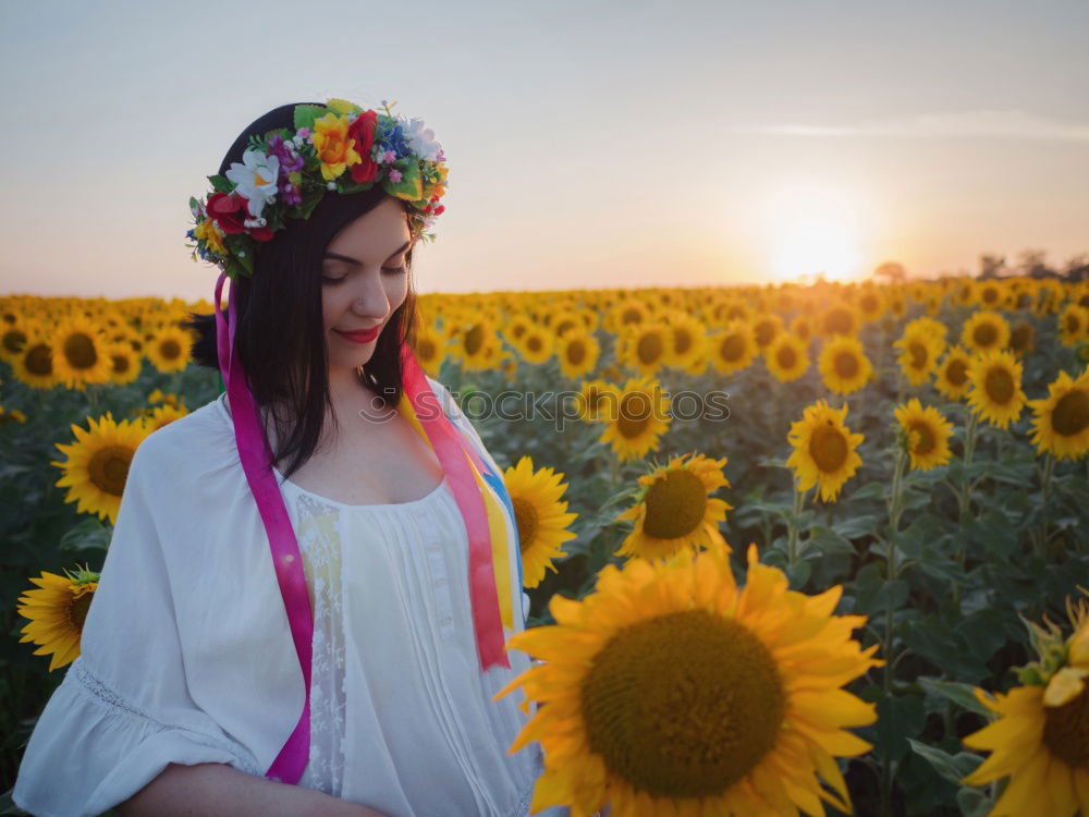 Similar – Image, Stock Photo Happy young black woman walking in a sunflower field