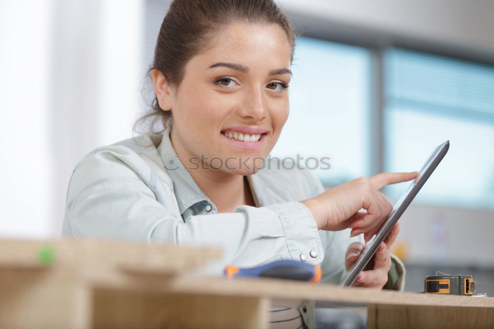 Similar – Image, Stock Photo Young woman with very short haircut with smart phone