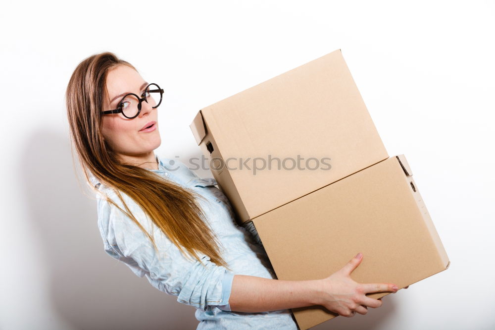 Similar – young woman sits in moving box