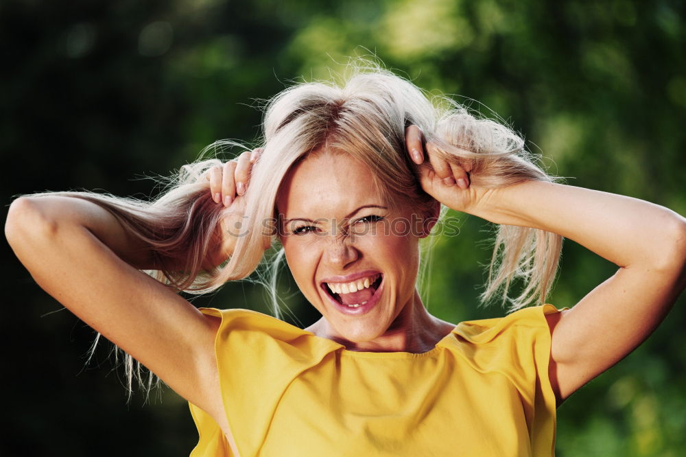 Similar – Junge Frau lacht draußen in der Natur freudig euphorisch positiv überrascht in die Kamera