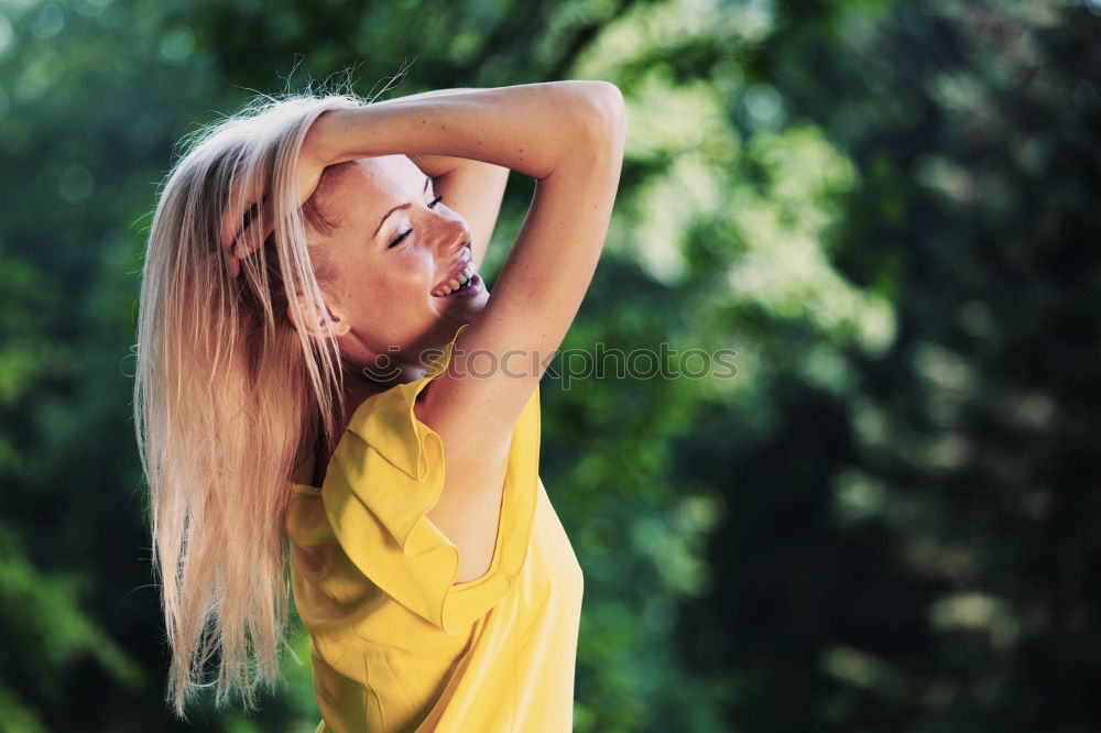 Similar – Cheerful brunette woman lying in grass