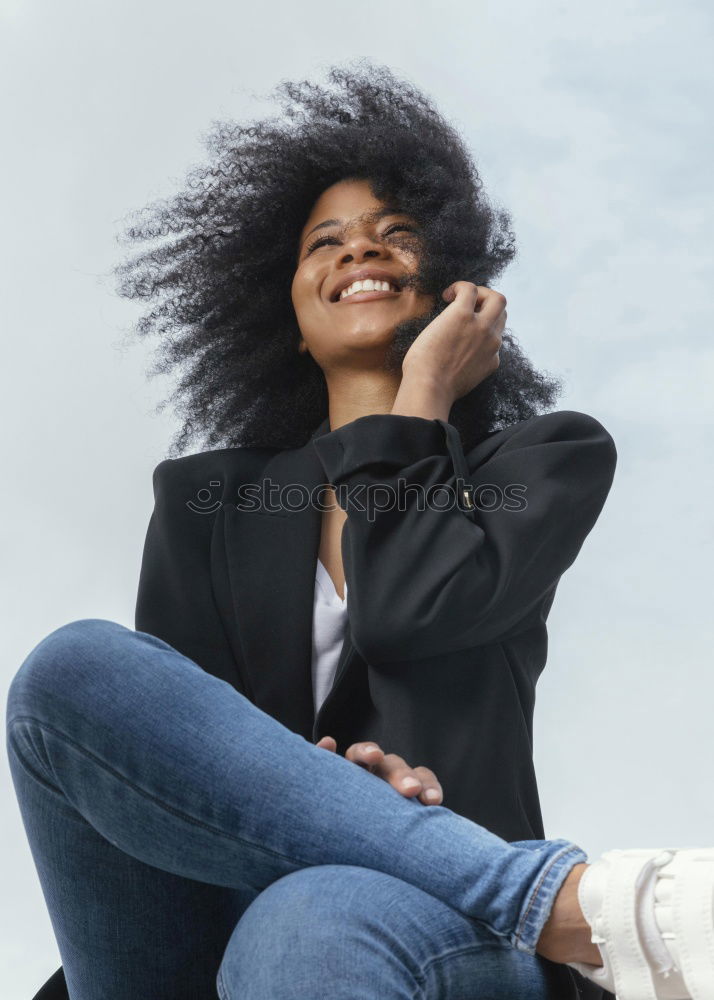 Similar – close up of a pretty black woman with curly hair smiling sit on bed looking at the camera