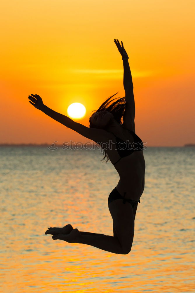 Similar – Father and son playing on the beach at the sunset time.