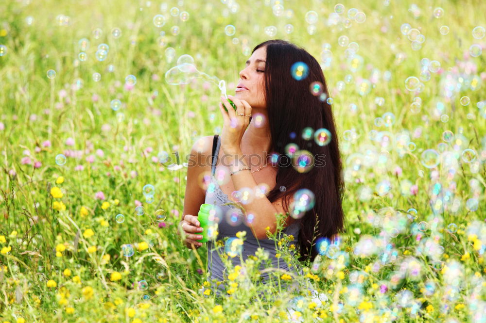 Similar – Image, Stock Photo Beautiful young woman in summer on yellow meadow from rape to horizon. Pretty girl with zest for life enjoys the sunshine break and life. Rest and recharge energy from time stress in environment and nature idyll. Laterally from behind.